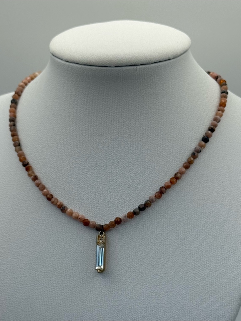Multi-Tone Peach Beaded Necklace with Blue Crystal Pendant